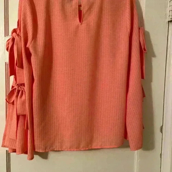 Cece beautiful peach blouse.  This blouse has bell sleeves with tie closures. - Picture 4 of 7